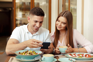 Two people in cafe enjoying the time spending with each other