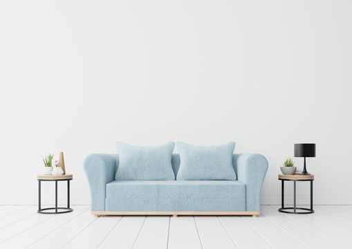 The interior has a blue sofa and flower,lamp,book on empty white wall background,3D rendering