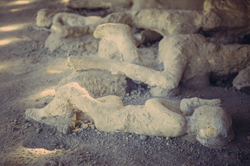 Fototapeta na wymiar some plaster casts of the victim of the eruption's death still in actual Pompeii. The city is mainly famous for the ruins of the ancient city of Pompeii, destroyed by the eruption of Vesuvius