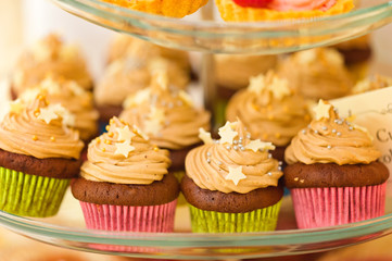 Chocolate cupcakes with caramel cream and starry decoration