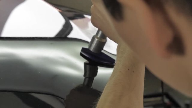 PDR technology. Repair car body. Remove dent from the car without painting