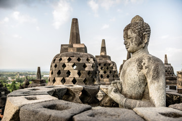 buddha statue at meditation posture in Borobudur temple, indonesia