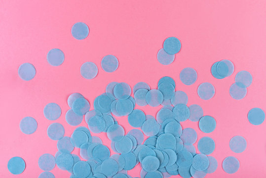 Blue Confetti On Pink Background.