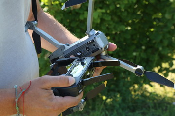 Dron in the hands of man