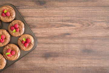 Delicious chocolate lava cakes with fresh raspberries and mint in the iron pan