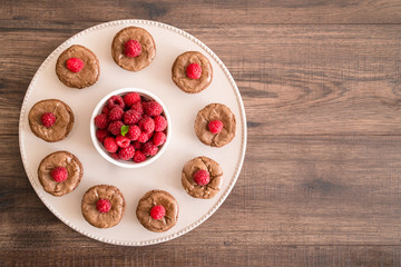 Delicious chocolate lava cakes with fresh raspberries and mint, on the plate
