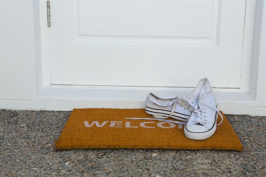 Canvas shoes on a door mat