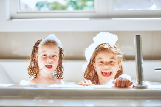 children are bathing in a bath