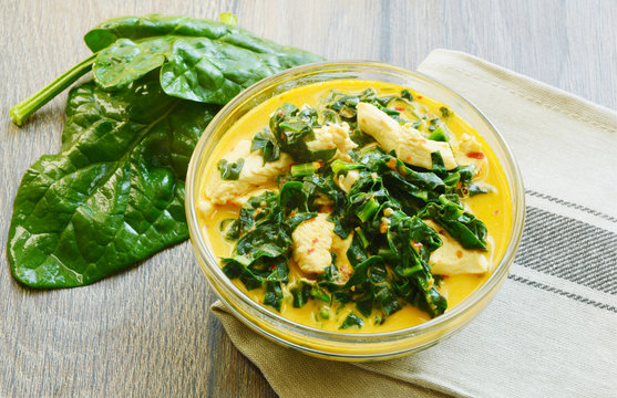Spinach and chicken breast  with curry and coconut soup Thai menu. ( Thai name is Gaeng Om kai  pak khom)
