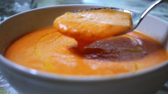 Fresh and tasty A bowl of Salmorejo. Typical summer meal, puree consisting of tomato and bread, originating from Cordoba in Andalucia, south Spain. It is made from tomatoes, bread, oil, garlic.