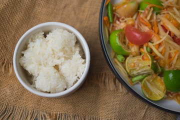 Close up of sticky rice served on white bowl