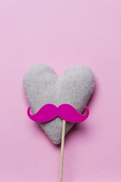 Pink Moustache On A Pink Background. Modern Masculinity Concept