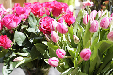 Roses and tulips ready for sale in a street flower market