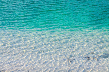 Turquoise water with reflections of light