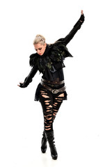 full length portrait of blonde girl wearing torn black feather costume. standing pose, isolated on white background.