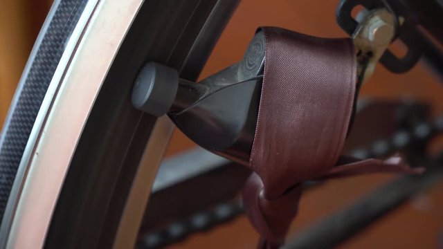 Bicycle wheel with spokes spinning moves, bicycle`s dynamo in action