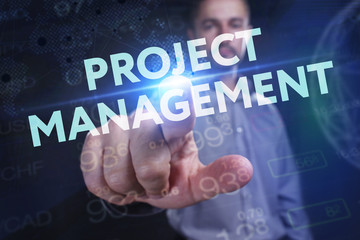 The concept of business, technology, the Internet and the network. A young entrepreneur working on a virtual screen of the future and sees the inscription: Project management