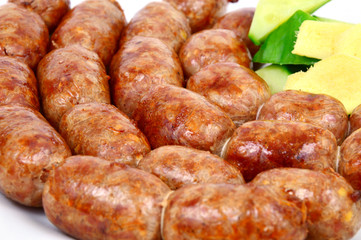 Easten thai sausage (Thai name is Sai Krok Isan) on white background.
ground pork with vermicelli,Rice and garlic  Sausage.