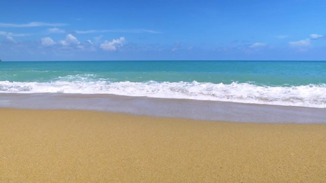 Beautiful blue ocean on sandy beach background with slow motion scene.