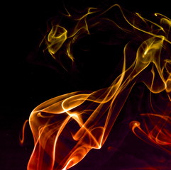 Colored smoke on black background
