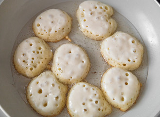 Preparation of pancakes in a frying pan. Homemade Fritters Cooking. 