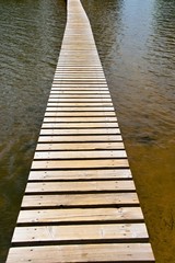 plank footbridge over water