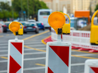 with warning lights a road construction site is secured
