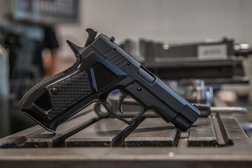 pistol on the table in the workshop
