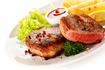 Grilled steaks and vegetables