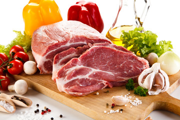 Fresh raw pork on cutting board on white background