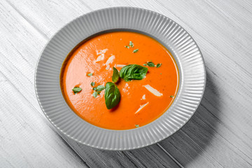 Tomato soup on wooden table