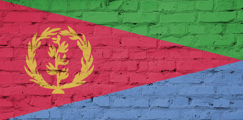 Texture of a flag of Eritrea on a brick wall.
