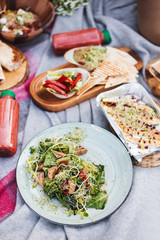 Close up photo of picnic delicious food on blanket in city park
