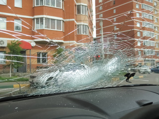 broken car windshield, dent on glass, trowel on glass, replacement glass, view from the cabin