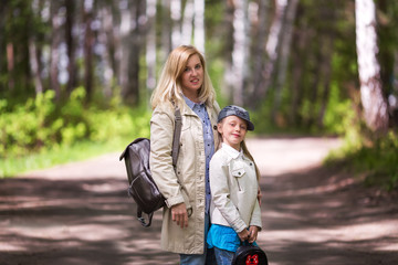 Fototapeta premium Mother and daughter in autumn park