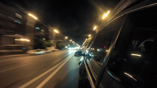 Point of view hyperlapse of a car driving on a city street at night