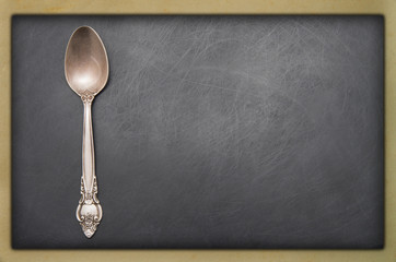 Vintage metal spoon on dark background