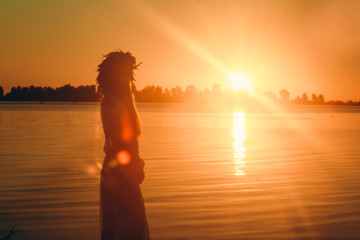 Silhouette girl against the backdrop of Sunrise