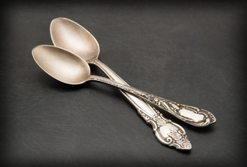 Vintage metal spoon on dark background