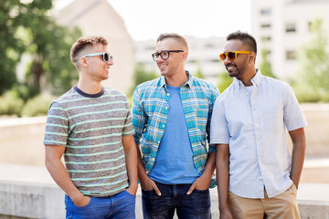 male friendship, summer and eyewear - happy young men in sunglasses outdoors