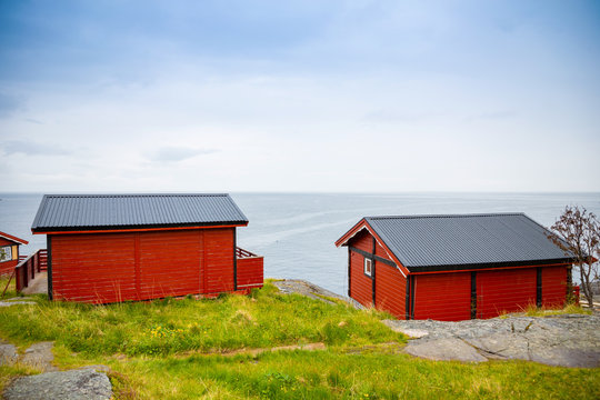 Traditional red camping houses with a beautiful sea view next to village A, lofoten, Norway