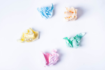 Crumpled colored paper on a white background, smooth blue sheet
