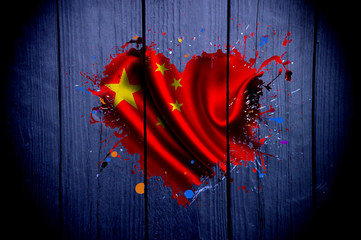 Flag of China in the shape of heart on a dark background