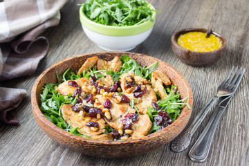 Salad with ruccola, grilled turkey or chicken, dried cranberries, pine nuts and citrus sauce. 