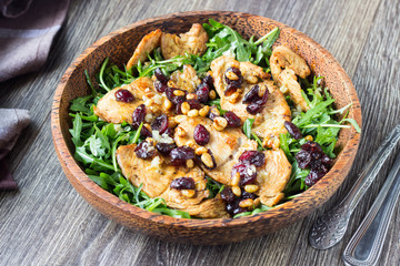 Salad with ruccola, grilled turkey or chicken, dried cranberries, pine nuts and citrus sauce. 