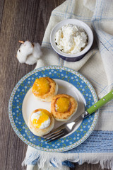 Cottage cheese pancakes on a plate with sour cream and orange jam. Syrniki. Traditional Ukrainian and Russian cuisine
