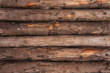 Wooden log wall in the form of a background texture