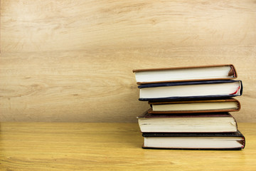 Books and notepads on a table. School knowledge and education concept.