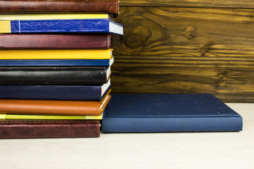 Books and notepads on a table. School knowledge and education concept.