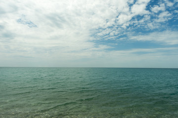 sea against a blue sky with clouds. landscape, leisure. resort. beautiful view of the summer sea.